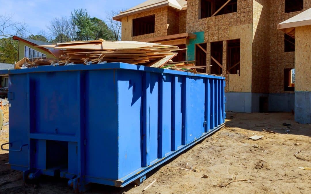 Dumpster full of building materials at construction site